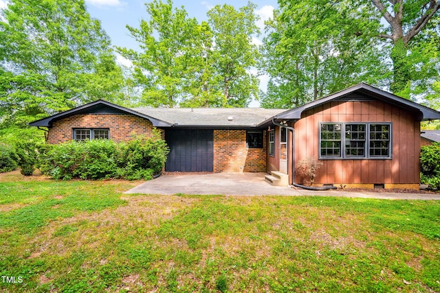single story home featuring a patio, crawl space, brick siding, and a front yard