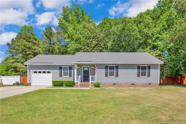 single story home with an attached garage, fence, driveway, and a front yard