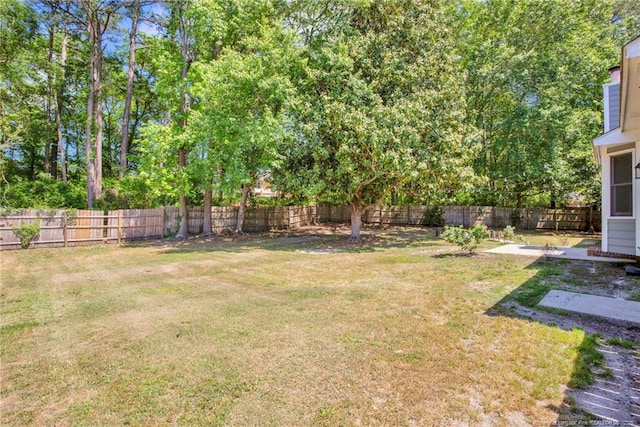 view of yard with a fenced backyard