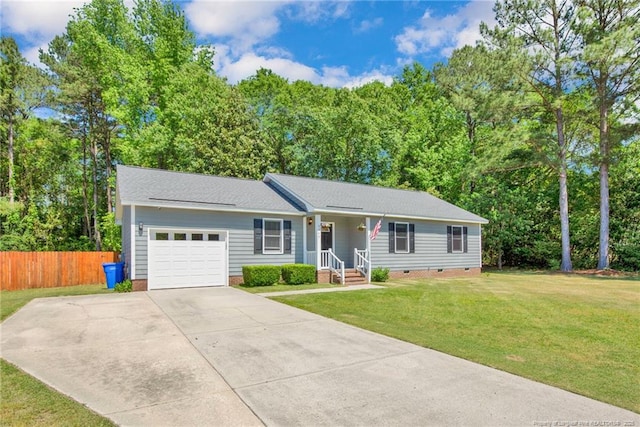 ranch-style house featuring fence, an attached garage, a front lawn, crawl space, and driveway