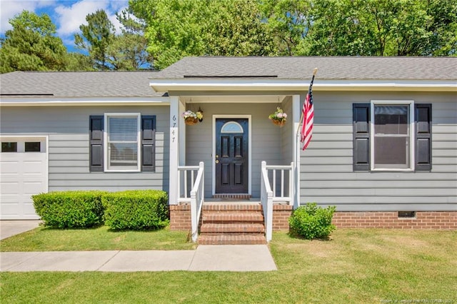ranch-style home with a garage, a front yard, roof with shingles, and crawl space