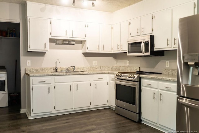 3254 Blossom Dr, Fayetteville, NC 28306 - kitchen featuring white cabinets, appliances with stainless steel finishes, a sink, light countertops, and dark wood-type flooring