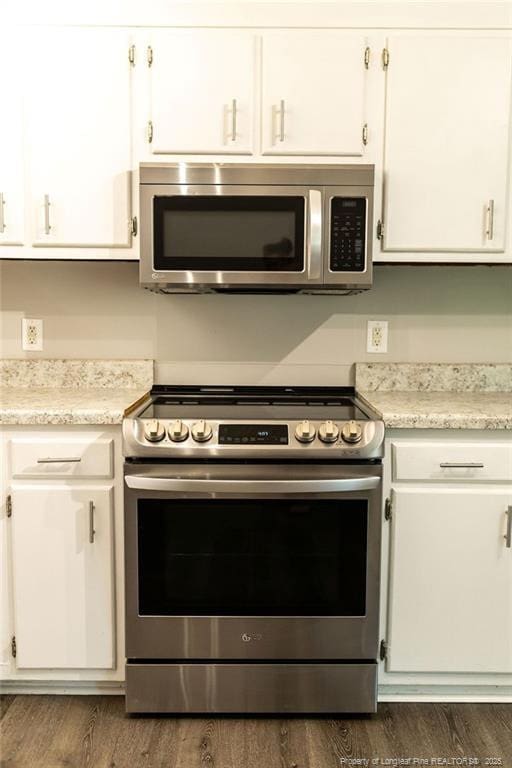 3254 Blossom Dr, Fayetteville, NC 28306 - kitchen with white cabinets, stainless steel appliances, and light countertops