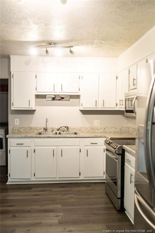 3254 Blossom Dr, Fayetteville, NC 28306 - kitchen featuring white cabinets, appliances with stainless steel finishes, a sink, light countertops, and a textured ceiling