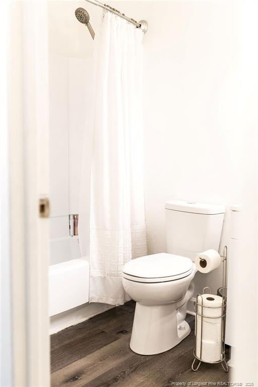 3254 Blossom Dr, Fayetteville, NC 28306 - bathroom with wood finished floors, shower / bath combo, and toilet