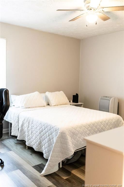 3254 Blossom Dr, Fayetteville, NC 28306 - bedroom featuring a ceiling fan and wood finished floors