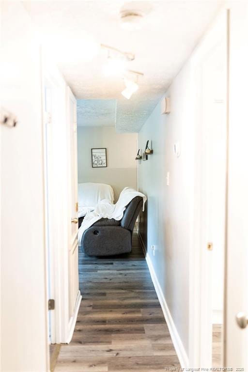 3254 Blossom Dr, Fayetteville, NC 28306 - hallway featuring baseboards and wood finished floors