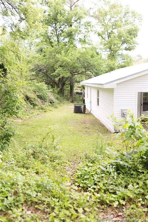 3254 Blossom Dr, Fayetteville, NC 28306 - view of yard with central AC unit
