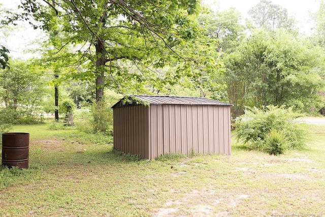 3254 Blossom Dr, Fayetteville, NC 28306 - view of shed featuring a forest view