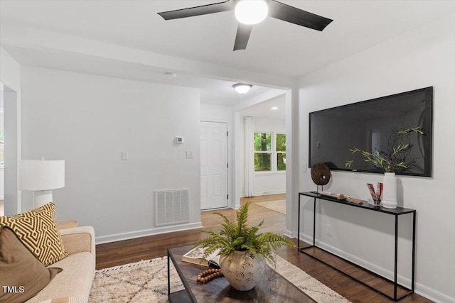 3907 Inwood Dr, Durham, NC 27705 - living area with wood finished floors, ceiling fan, and baseboards