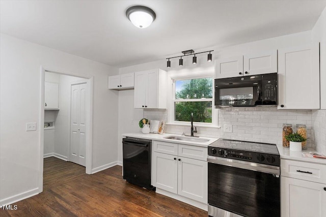 3907 Inwood Dr, Durham, NC 27705 - kitchen with black appliances, a sink, tasteful backsplash, and white cabinetry
