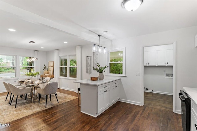 3907 Inwood Dr, Durham, NC 27705 - kitchen with dark wood-type flooring, baseboards, a peninsula, and recessed lighting