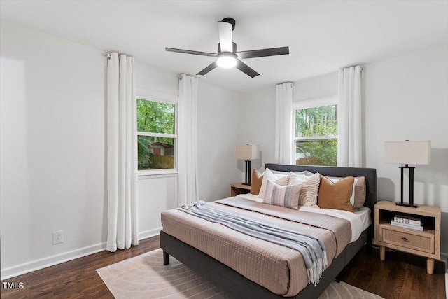3907 Inwood Dr, Durham, NC 27705 - bedroom featuring multiple windows, wood finished floors, baseboards, and ceiling fan