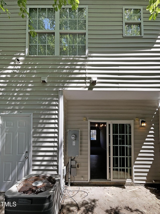 view of exterior entry featuring central AC