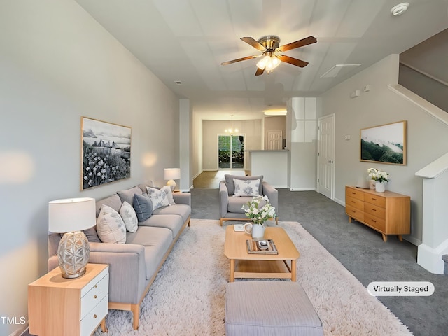 carpeted living room with a ceiling fan and baseboards