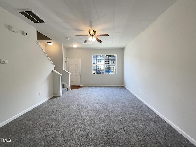 unfurnished living room with carpet, a ceiling fan, baseboards, visible vents, and stairway