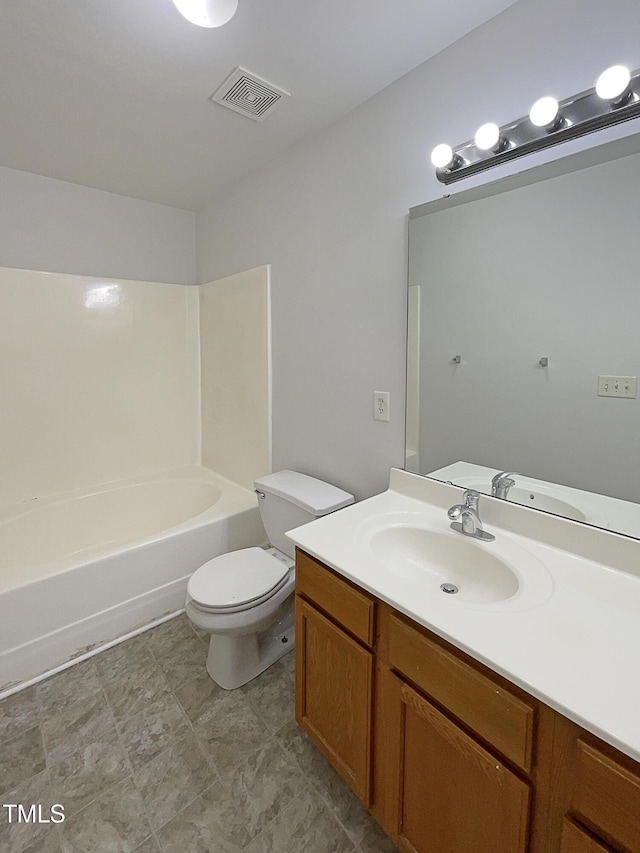 bathroom featuring visible vents, toilet, and vanity
