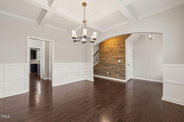5011 Peachtree Town Ln, Knightdale, NC 27545 - empty room featuring a chandelier, arched walkways, coffered ceiling, wood finished floors, and stairway