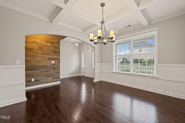 5011 Peachtree Town Ln, Knightdale, NC 27545 - unfurnished room featuring a chandelier, arched walkways, coffered ceiling, beam ceiling, and wood-type flooring