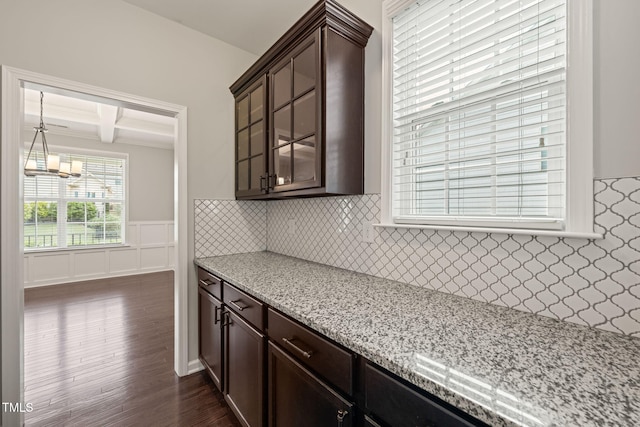 5011 Peachtree Town Ln, Knightdale, NC 27545 - kitchen with a chandelier, dark wood-type flooring, dark brown cabinetry, coffered ceiling, and beamed ceiling