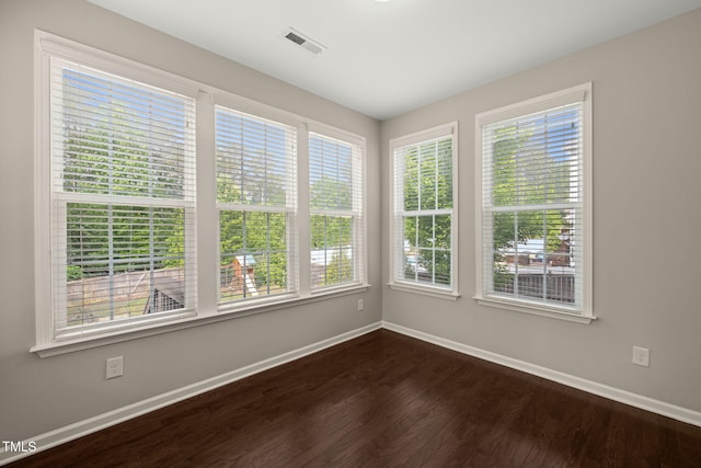5011 Peachtree Town Ln, Knightdale, NC 27545 - spare room featuring baseboards and dark wood-style flooring