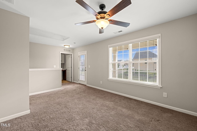 5011 Peachtree Town Ln, Knightdale, NC 27545 - empty room featuring attic access, a ceiling fan, carpet flooring, and baseboards