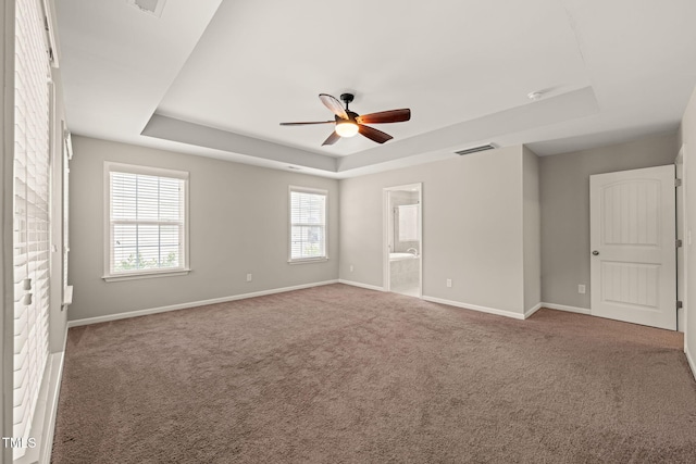 5011 Peachtree Town Ln, Knightdale, NC 27545 - carpeted spare room with a raised ceiling, baseboards, and ceiling fan