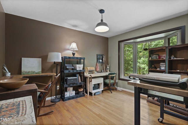 home office featuring wood finished floors and baseboards