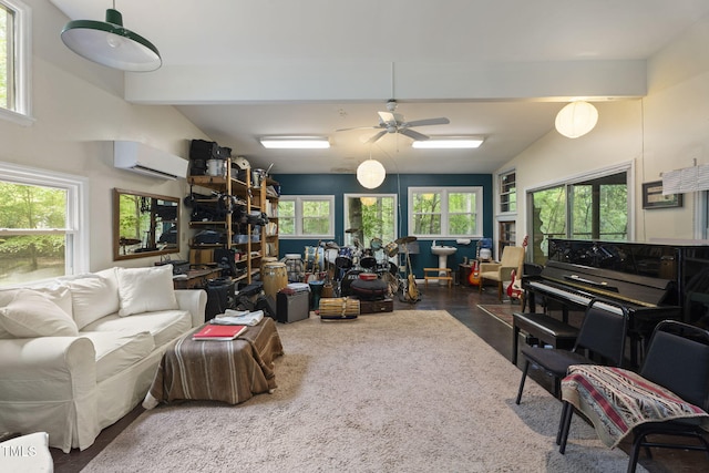 living room featuring a wall mounted AC, ceiling fan, and beam ceiling