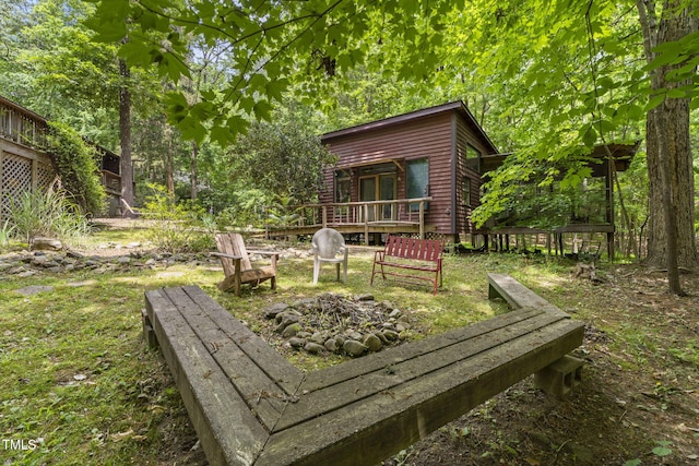 wooden deck featuring a fire pit