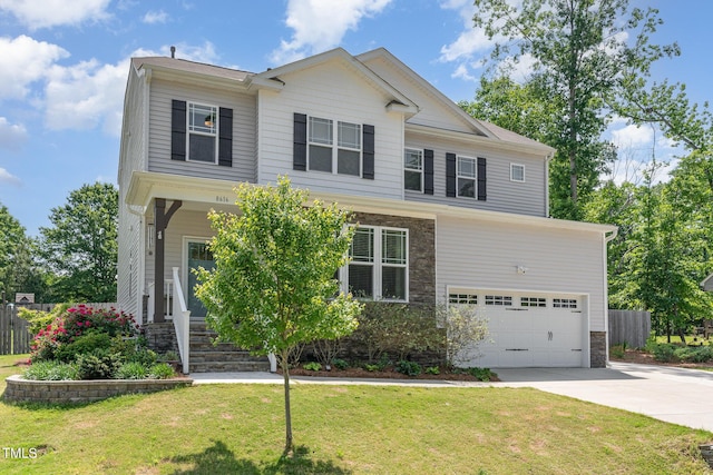 view of front facade featuring fence, an attached garage, a front lawn, stone siding, and concrete driveway