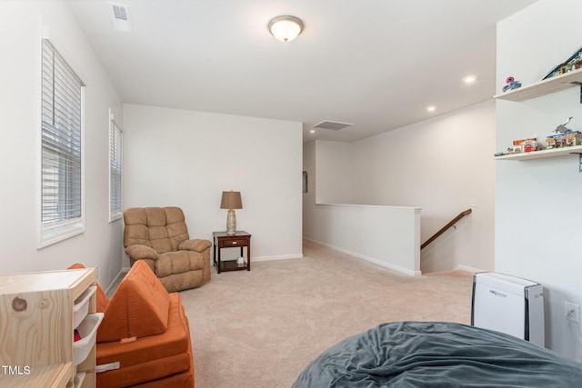 sitting room featuring visible vents, baseboards, recessed lighting, carpet flooring, and an upstairs landing