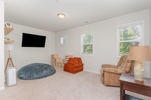 sitting room featuring baseboards, carpet, and visible vents