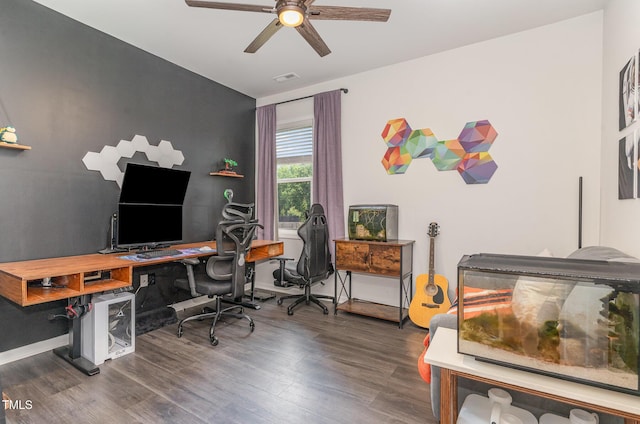 office area with baseboards, ceiling fan, and wood finished floors