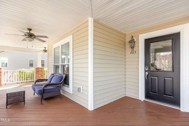 deck featuring a porch and a ceiling fan