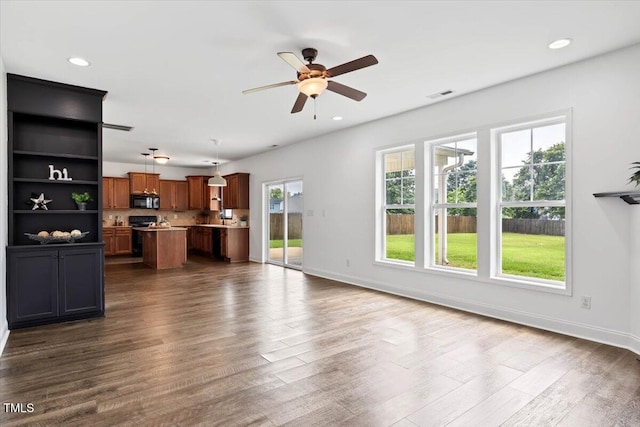 206 Wynngate Dr, Cameron, NC 28326 - unfurnished living room with dark wood-style flooring, a ceiling fan, baseboards, and recessed lighting
