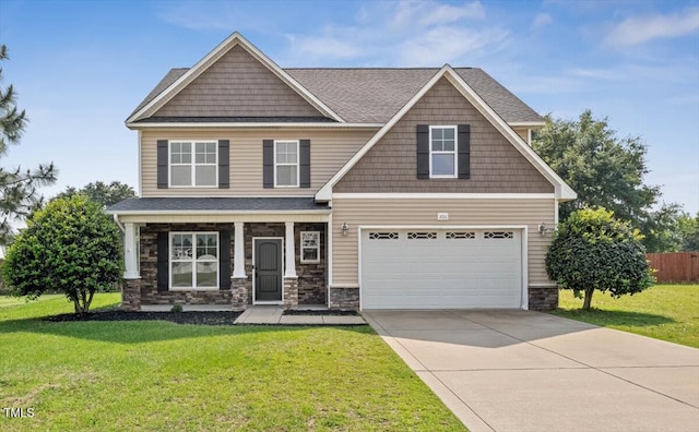 206 Wynngate Dr, Cameron, NC 28326 - craftsman-style house featuring an attached garage, driveway, stone siding, roof with shingles, and covered porch