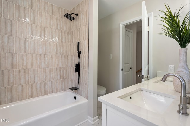 bathroom featuring vanity, toilet, and  shower combination