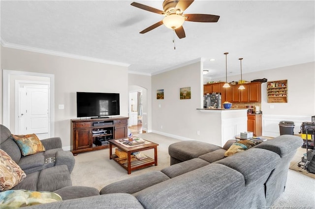 110 Wynngate Dr, Cameron, NC 28326 - living room featuring crown molding, ceiling fan, light carpet, arched walkways, and baseboards