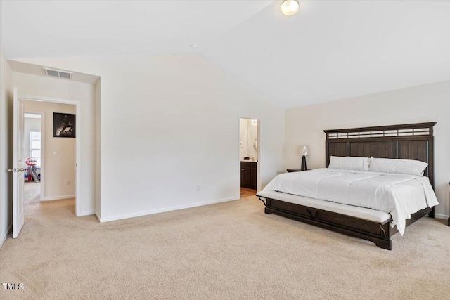 3912 Huntsmoor Ln, Wilson, NC 27896 - bedroom featuring visible vents, carpet floors, lofted ceiling, baseboards, and ensuite bath