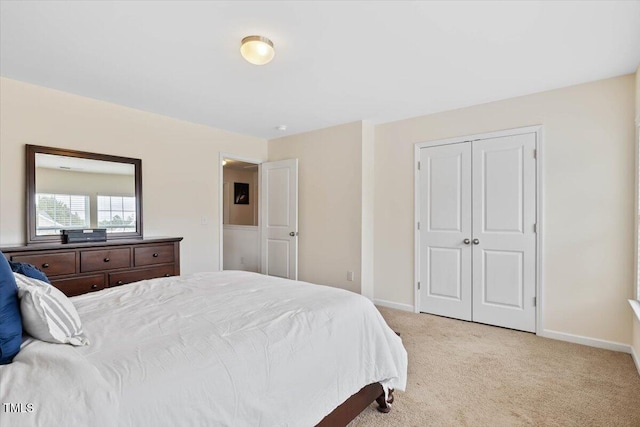 3912 Huntsmoor Ln, Wilson, NC 27896 - bedroom with baseboards, a closet, and light colored carpet