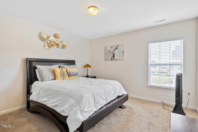3912 Huntsmoor Ln, Wilson, NC 27896 - carpeted bedroom with baseboards and visible vents