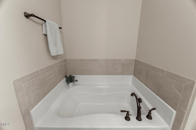 bathroom with a garden tub