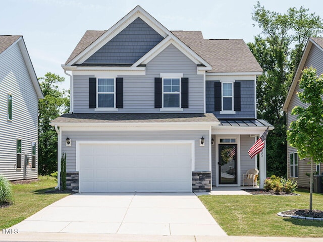 555 Whitley Ridge Dr, Clayton, NC 27527 - craftsman-style home featuring stone siding, concrete driveway, a front lawn, and an attached garage