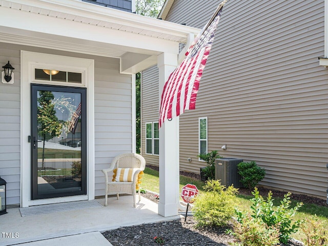 555 Whitley Ridge Dr, Clayton, NC 27527 - view of exterior entry featuring cooling unit and a porch