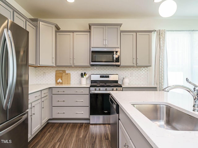 555 Whitley Ridge Dr, Clayton, NC 27527 - kitchen featuring stainless steel appliances, gray cabinetry, a sink, dark wood-style flooring, and recessed lighting