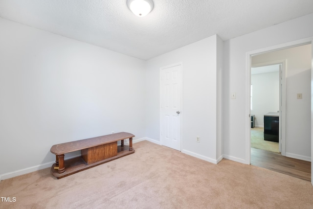 145 Mark St, Franklinton, NC 27525 - unfurnished bedroom with baseboards, carpet flooring, and a textured ceiling
