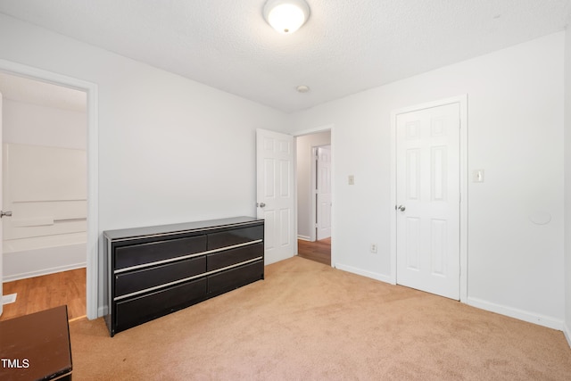 145 Mark St, Franklinton, NC 27525 - unfurnished bedroom featuring carpet floors, baseboards, and a textured ceiling