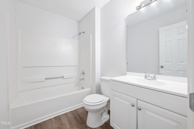 145 Mark St, Franklinton, NC 27525 - bathroom with a textured ceiling, shower / tub combination, wood finished floors, vanity, and toilet