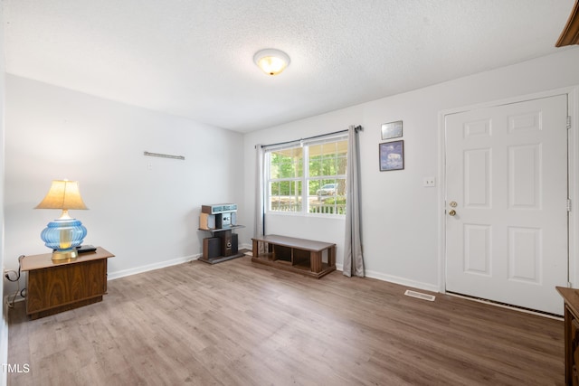 145 Mark St, Franklinton, NC 27525 - entryway with baseboards, wood finished floors, and visible vents